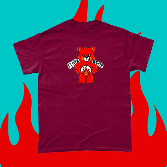 Flare Bear T-shirt on a blue and red flame background. The cardinal red short sleeve tshirt is of a red bear with a fed up expression and hands on its hips. There is a white circle on its belly with flames inside. Flare Bear is written on the middle. The tshirt is designed to raise awareness for chronic illness flare ups.