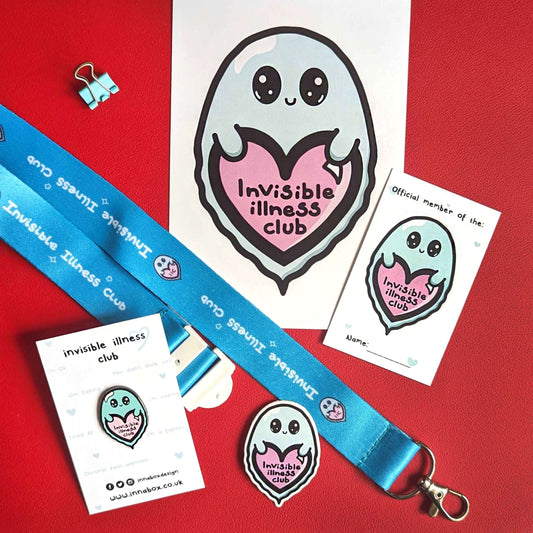Contents of Invisible Illness Club Bundle, featuring Invisible illness club Lanyard, Invisible illness club postcard, Invisible illness club sticker, Invisible illness club enamel pin and Invisible illness club membership card. Contents is shown on a red background. Each item features a cute mint green ghost with big eyes and little smile holding a pink heart with it's little hands that has 'invisible illness club' written in black writing in the middle of the heart