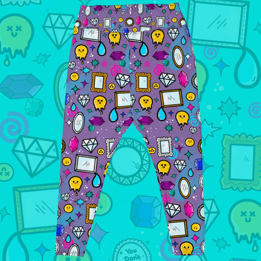 The You Don't Look Sick Plus Size Leggings on a blue background with a faded version of the print. The purple base leggings features melting yellow smiley faces, mirrors, gemstones, teardrops, sparkles, swirls and dots with a centre hand held mirror reading 'you don't look sick'. The hand drawn design is raising awareness for invisible illnesses.