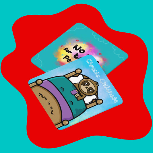 The No Time for Toxic People Coaster on a red and blue background with the innabox chronic chillness sloth coaster. The blue base wooden coaster features faded cloud outlines around the border with a pink, yellow, red and white multicoloured cloud explosion in the middle with black text reading 'no time for toxic people'. Surrounding the middle text is mini flowers, sparkles, clouds, hearts, circles, stars, moons and lightning bolts in red, blue and yellow.