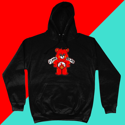 Flare Bear black hoodie jumper shown on a red and blue background. The hoodie is of a red bear with a fed up expression and hands on its hips. There is a white circle on its belly with flames inside. Flare Bear is written on the hoodie. The hoodie is designed to raise awareness for chronic illness flare ups.