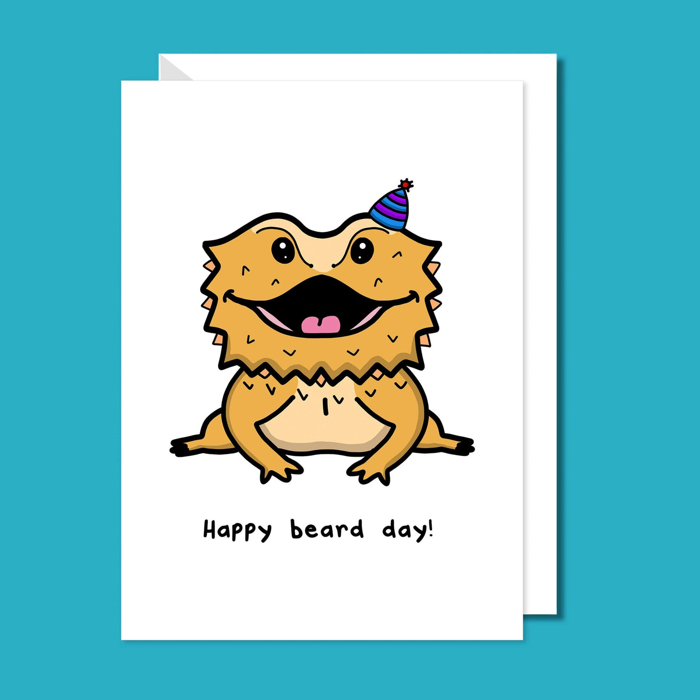 Happy Beard Day - Bearded Dragon A6 Birthday Card on a blue background with a white envelope underneath. The white card features a happy bearded dragon reptile wearing a purple stripe party hat, underneath in black reads Happy Beard Day!