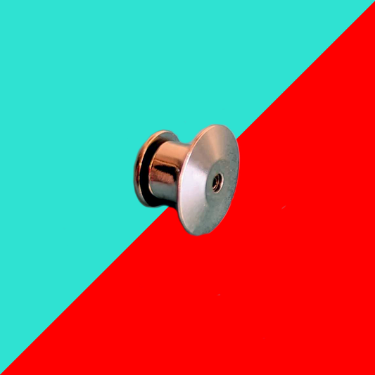 The Pin Locking Backs - Add On for Pins on a red and blue background. The silver locking pin badge back slots on the back of innabox enamel pin badges.