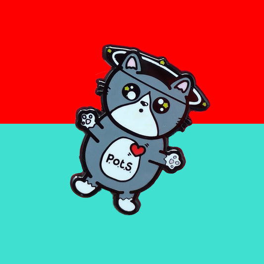 An enamel pin of a cat illustration with spinning dizzy stars around its head with its paws outstretched and postural tachycatdid syndrome (pots) written on its belly it is on a red and blue background. Postural tachycardia syndrome (PoTS) is when your heart rate increases very quickly after getting up from sitting or lying down.