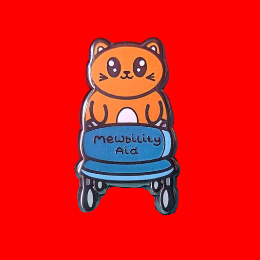 The Mewbility Aid Cat Enamel Pin - Mobility Aid on a red background. An orange smiling cat walking upright with a blue mobility aid, across the walking chair reads 'mewbility aid'. The hand drawn designs is raising awareness for mobility aids.