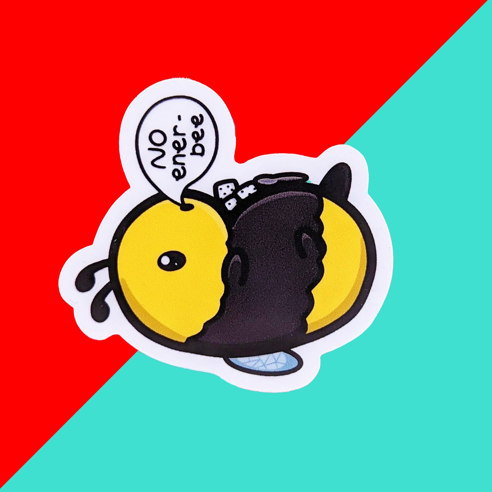 The low energy bee sticker shown on a blue and red checkered background. The sticker is a cute yellow and black bee lying on it's wings with its arms, legs, little belly and stinger in the air. The bee has a speech bubble coming from it's mouth with 'NO ener-bee' written inside in black writing.