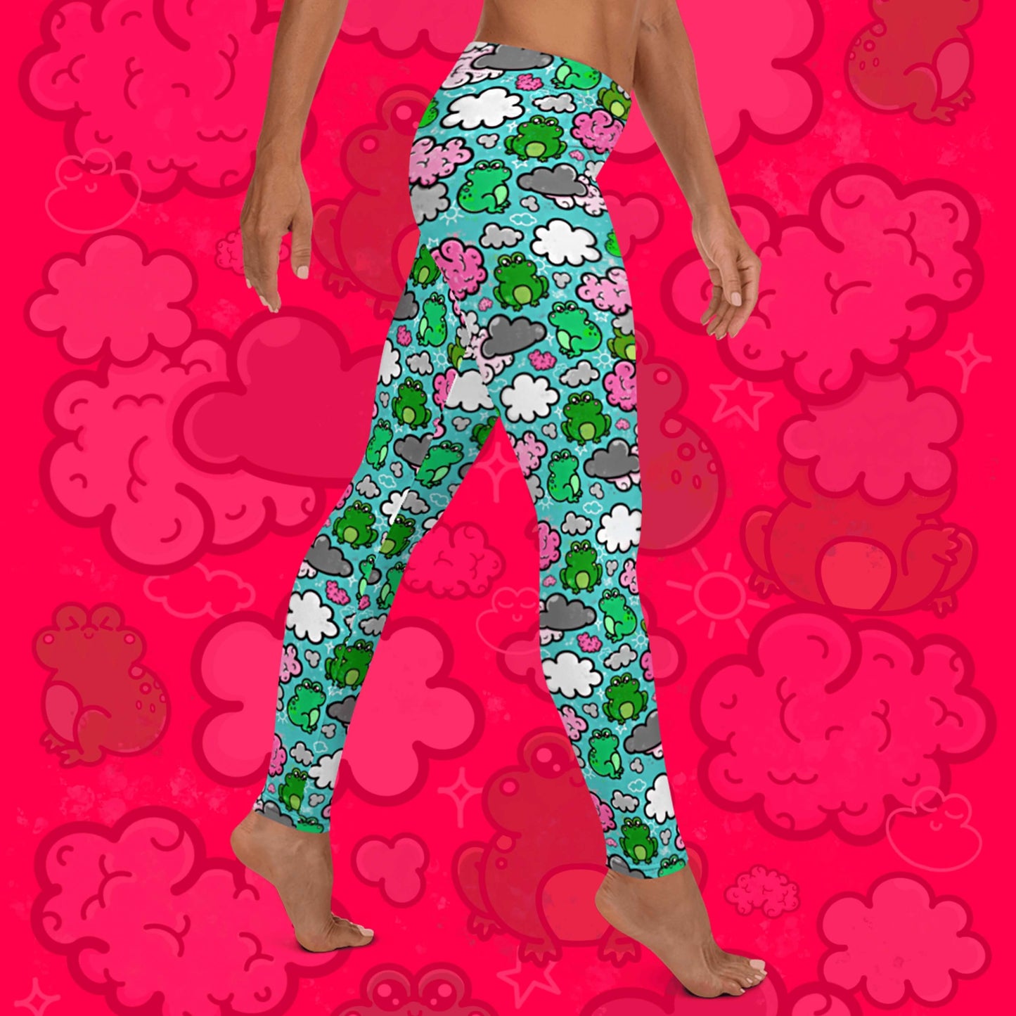 The Brain Frog Leggings - Brain Fog being worn by a model walking right on a red background with a faded brain frog print, the photo is cropped from the hips down. The leggings are an aqua blue base with various green kawaii face frogs with pink blush cheeks, pink brain style clouds, white and grey clouds and white sparkles all over. The design was created to raise awareness of Brain Fog.