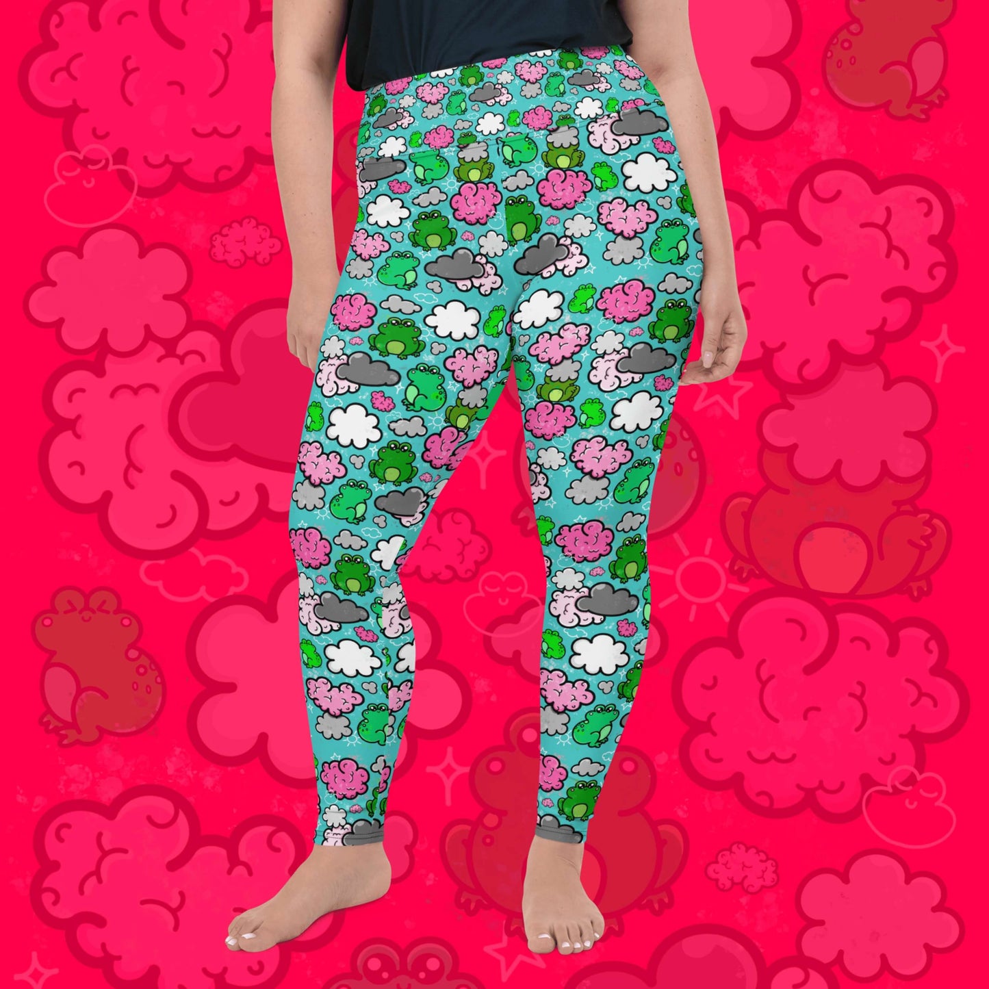 The Brain Frog Plus Size Leggings - Brain Fog being worn by a model facing forward with their left leg bent on a red background with a faded brain frog print, the photo is cropped from the hips down. The leggings are an aqua blue base with various green kawaii face frogs with pink blush cheeks, pink brain style clouds, white and grey clouds and white sparkles all over. The design was created to raise awareness of Brain Fog.