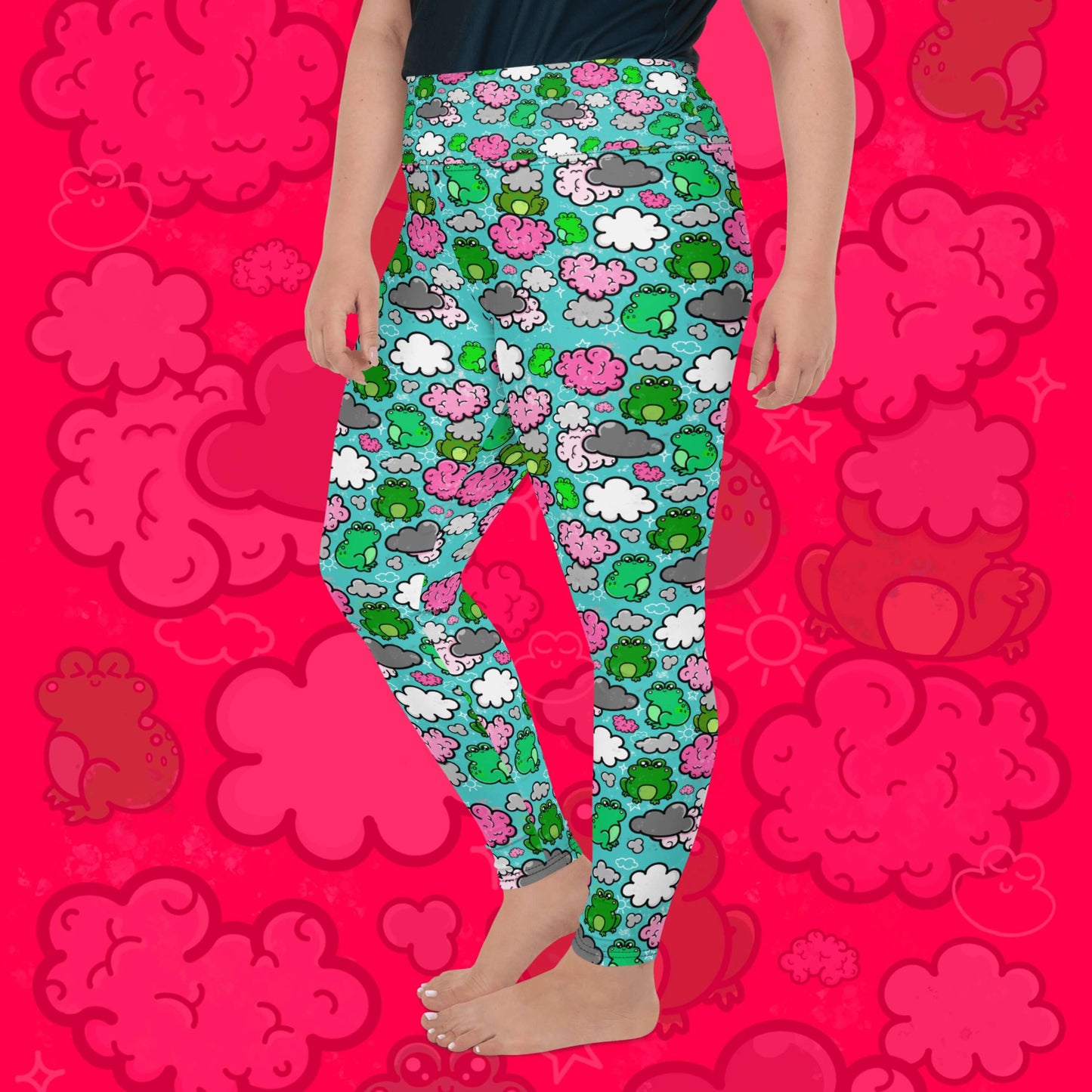 The Brain Frog Plus Size Leggings - Brain Fog being worn by a model facing left with their left leg bent on a red background with a faded brain frog print, the photo is cropped from the hips down. The leggings are an aqua blue base with various green kawaii face frogs with pink blush cheeks, pink brain style clouds, white and grey clouds and white sparkles all over. The design was created to raise awareness of Brain Fog.