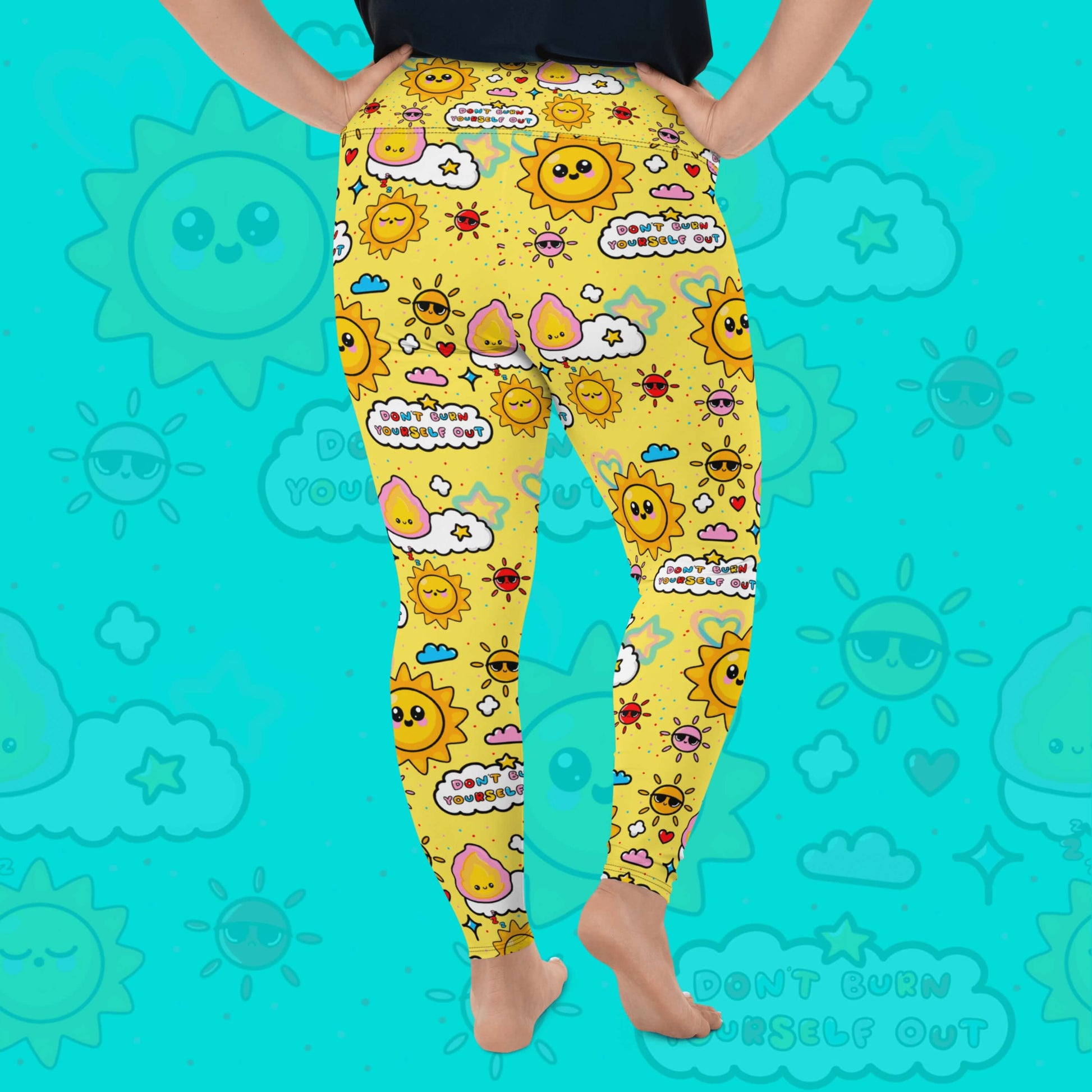The Don't Burn Yourself Out Plus Size Leggings on a model over an aqua blue background with a faded don't burn yourself print overlayed. The model is facing away with their right leg bent out to the side and both hands on their hips, the photo is cropped from the waist down. The print is yellow with various kawaii face sunshines, sparkles, hearts, pink flames and pink, blue and white clouds with don't burn yourself out inside in rainbow. Design inspired by the self care movement.