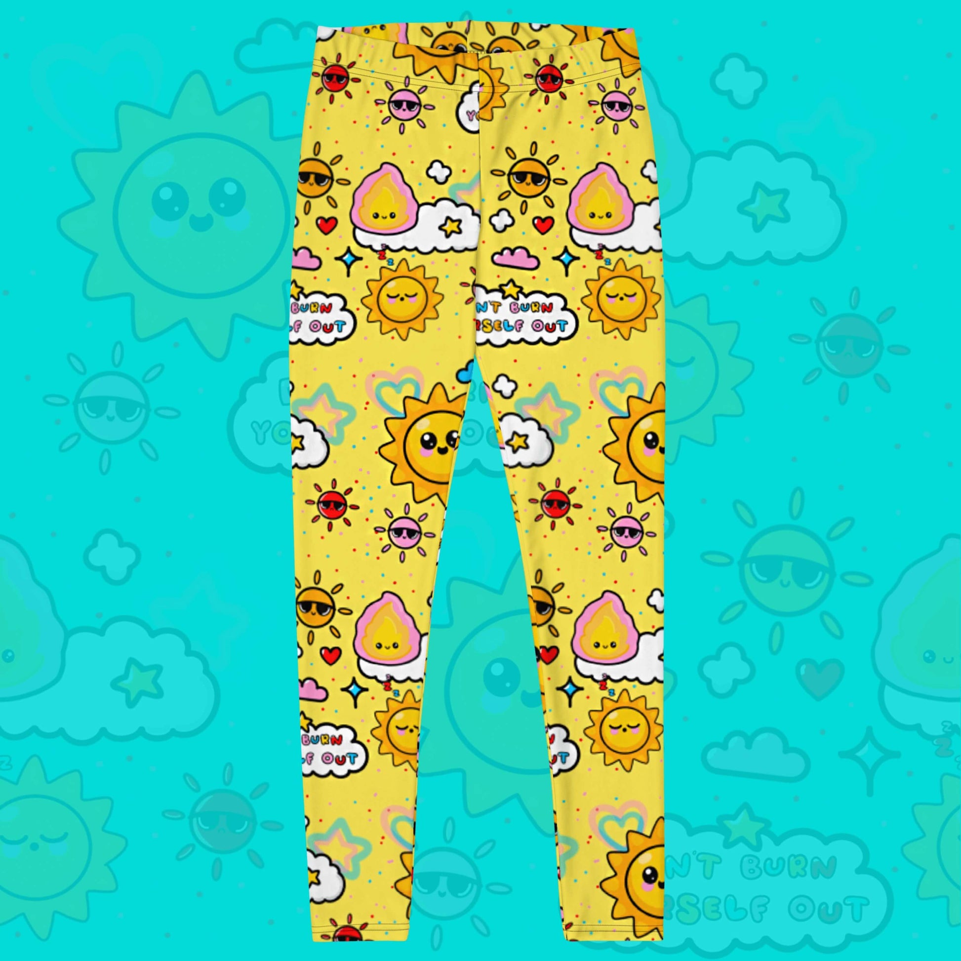 The Don't Burn Yourself Out Leggings on an aqua blue background with a faded don't burn yourself print overlayed. The print is yellow with various kawaii face sunshines, sparkles, hearts, pink flames and pink, blue and white clouds with don't burn yourself out inside in rainbow. Design inspired by the self care movement.