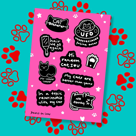 The Cat Parent Sticker Sheet - A6 Sticker Sheet on a red and blue paw print background. The pink sticker sheet with white sparkles, stars and paws is covered in black and white stickers with a cat theme such as 'cat botherer', 'hair we go again', 'hi random cat I love u', paws, cats and more.