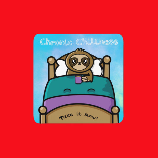 The Chronic Chillness Coaster - Chronic Illness on a red background. The blue base coaster features a sloth smiling in a wooden bed with blue and purple bedsheets clutching a purple mug of tea. Above in white reads 'chronic chillness' and along the bottom of the bed reads 'take it slow'. The design was created to raise awareness for chronic illness and invisible illness.