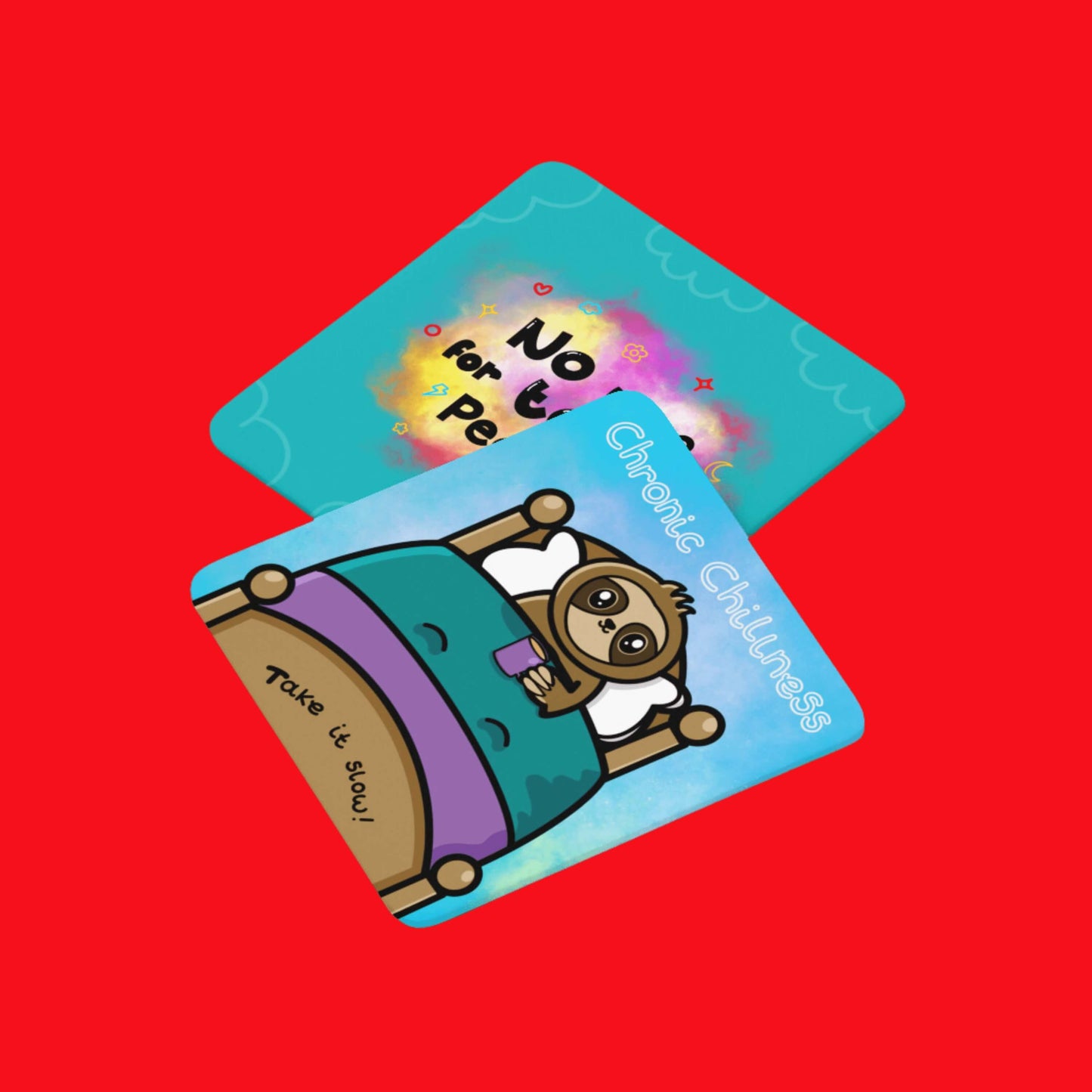 The Chronic Chillness Coaster - Chronic Illness on a red background with the no time for toxic people coaster from innabox. The blue base coaster features a sloth smiling in a wooden bed with blue and purple bedsheets clutching a purple mug of tea. Above in white reads 'chronic chillness' and along the bottom of the bed reads 'take it slow'. The design was created to raise awareness for chronic illness and invisible illness.