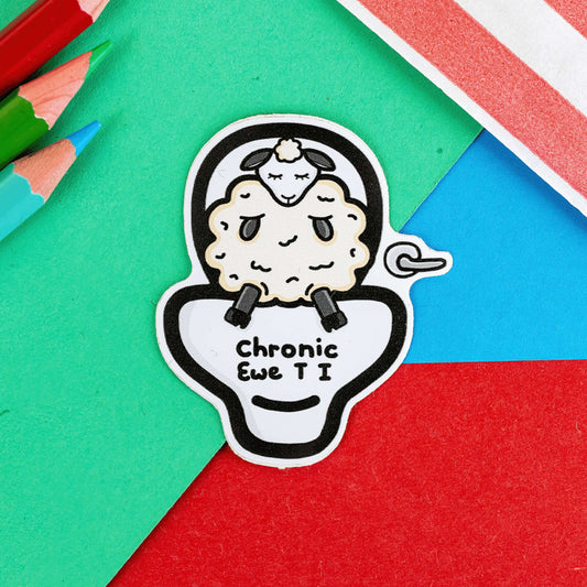 The Chronic Ewe T.I Sticker - Chronic UTI on a red, blue and green background with colouring pencils and red stripe candy bag. The sticker features a white sad sheep sat on a large white toilet with black text reading 'chronic ewe T I'. The design is raising awareness for chronic utis.