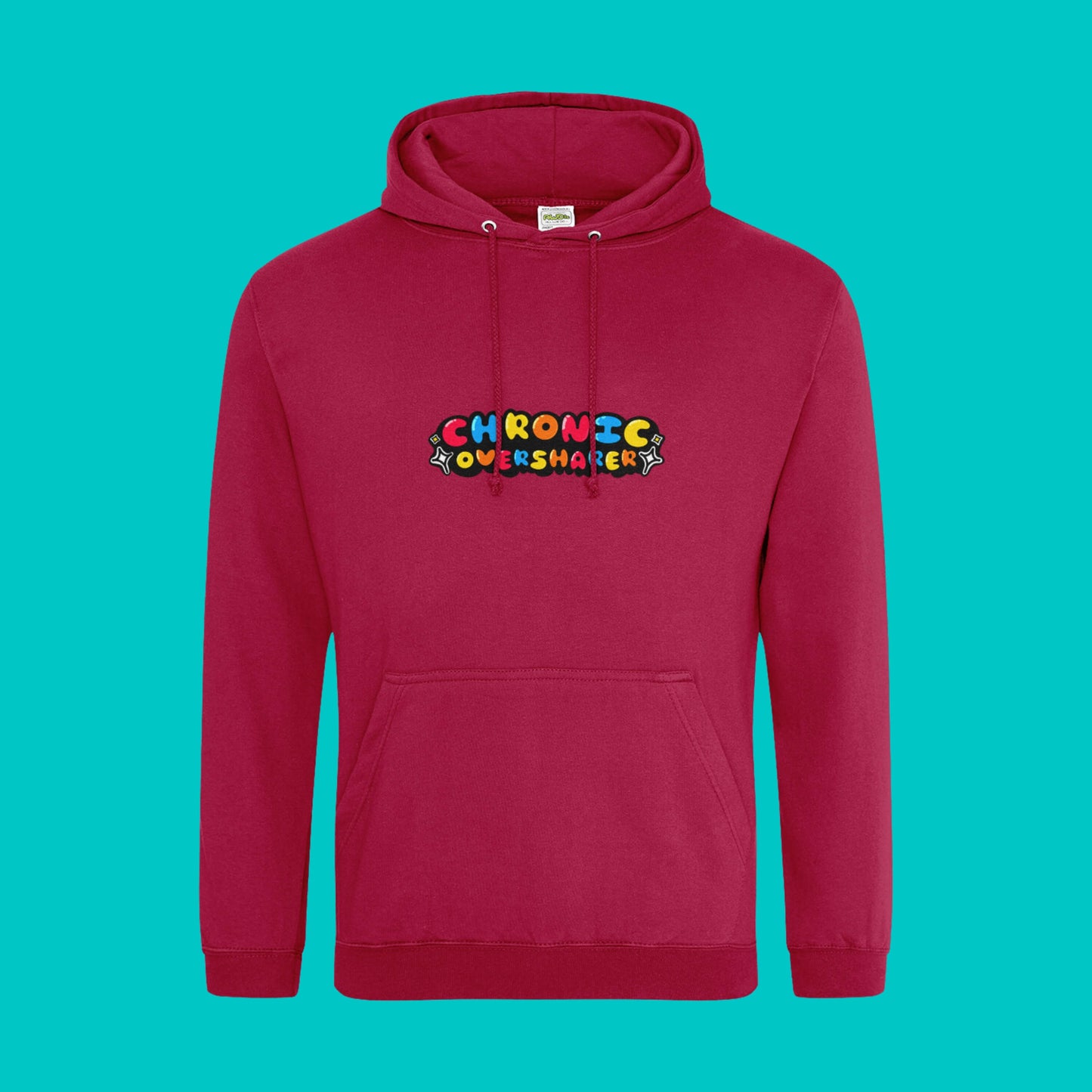 The Chronic Over Sharer Hot Chilli Red Hoodie shown on a blue background. The Hot Chilli Red hoodie features a drawstring hood, a large front pocket and the text 'chronic oversharer' in rainbow bubble font with a black shadow effect and white sparkles. The design was created to raise awareness for neurodivergent disorders such as ADHD.