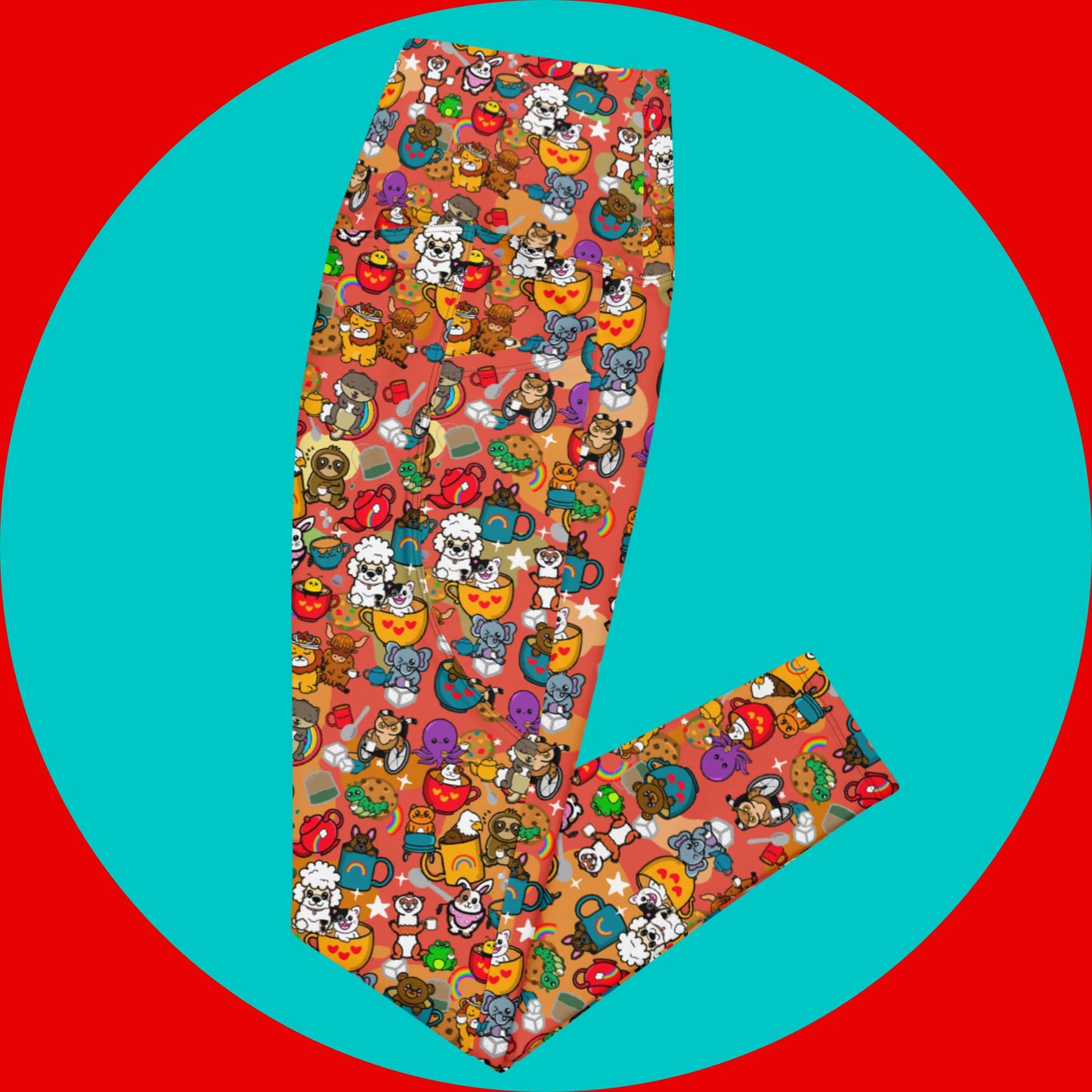 The Disabili Tea and Biscuits - Disability Leggings with Pockets folded in half on a red and blue background. The leggings feature various disabled and chronically ill animal characters drinking tea, sitting in tea mugs and holding up mugs. There is also various cookie biscuits, tea bags, sugar cubes, teapots, rainbows, sparkles and tea spills all underneath. The leggings are a punny gift raising awareness for disabilities.