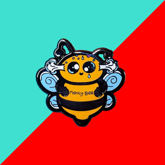 Menty-Bee Enamel Pin - Mental Breakdown on a red and blue background. The enamel pin is of a bee looking stressed with steam coming out of its head and the text menty-Bee on its chest. Hand drawn design made to raise awareness for mental breakdowns