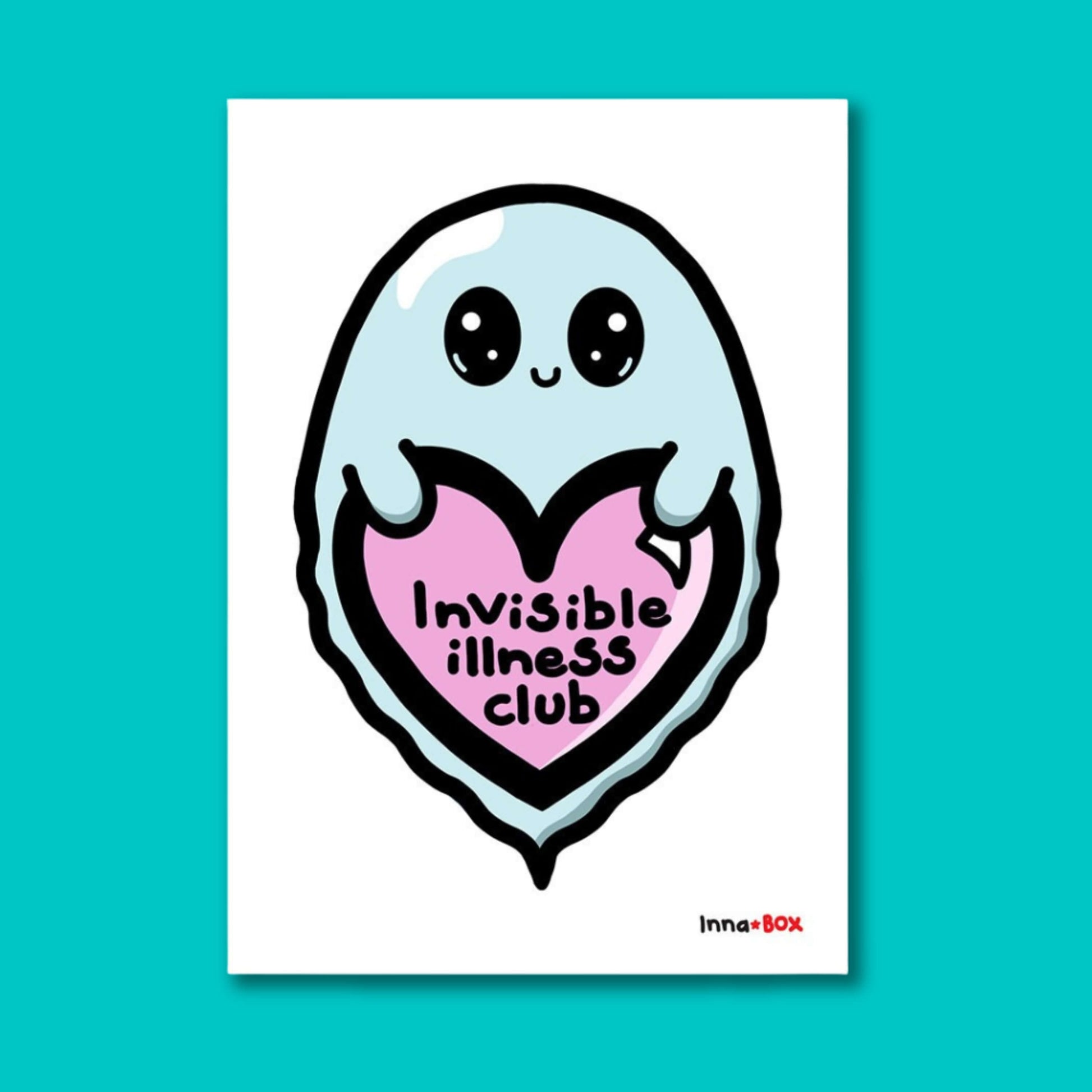 The Invisible Illness Club Postcard on a blue background. The white postcard print features a pastel blue smiling ghost with big sparkly eyes holding up a pink heart with black text reading 'invisible illness club' with the innabox logo in the bottom right corner. The hand drawn design is raising awareness for hidden disabilities and chronic illness.