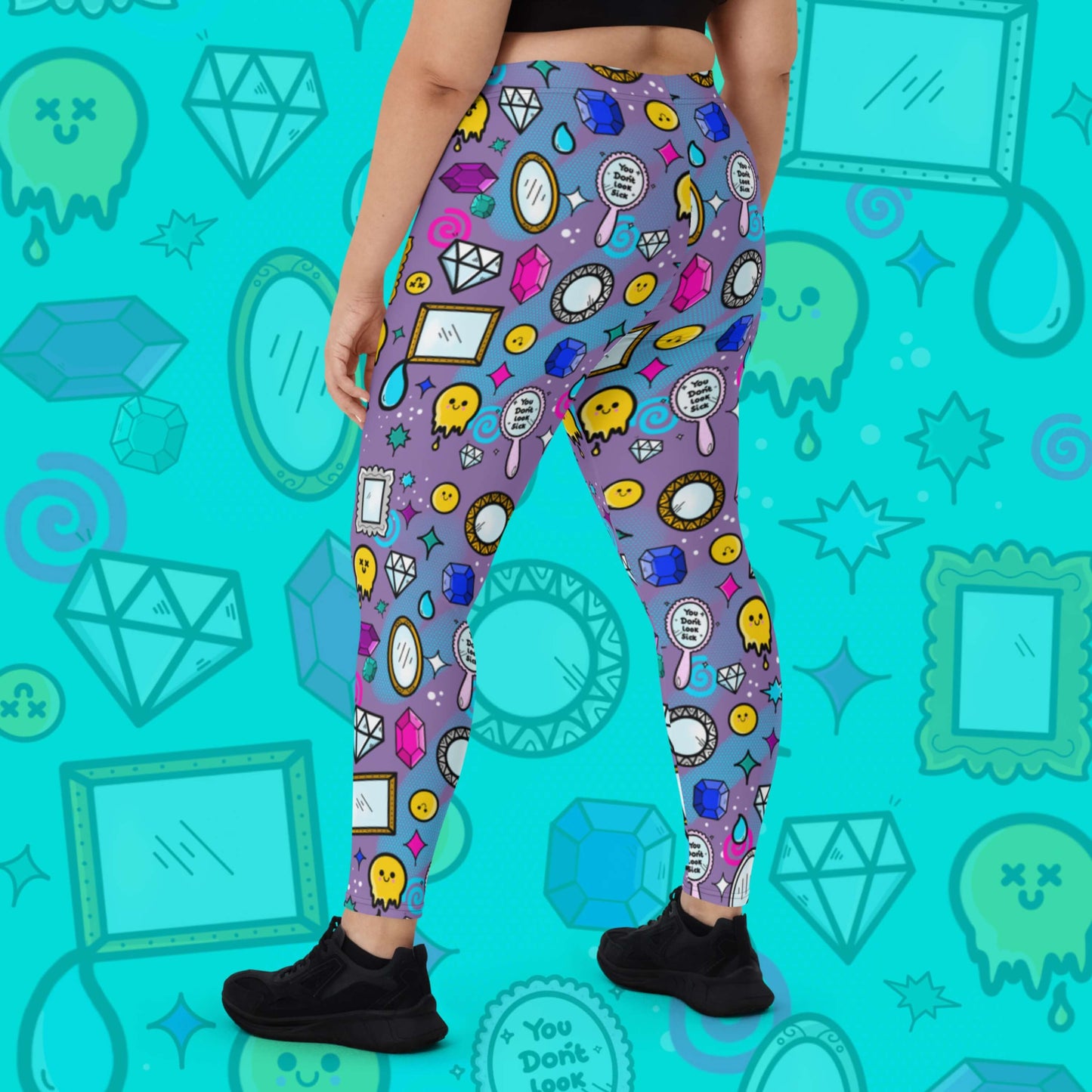 The You Don't Look Sick Leggings modelled by a femme person facing away with a black tshirt and black trainers on a blue background with a faded version of the print. The purple base leggings features melting yellow smiley faces, mirrors, gemstones, teardrops, sparkles, swirls and dots with a centre hand held mirror reading 'you don't look sick'. The hand drawn design is raising awareness for invisible illnesses.