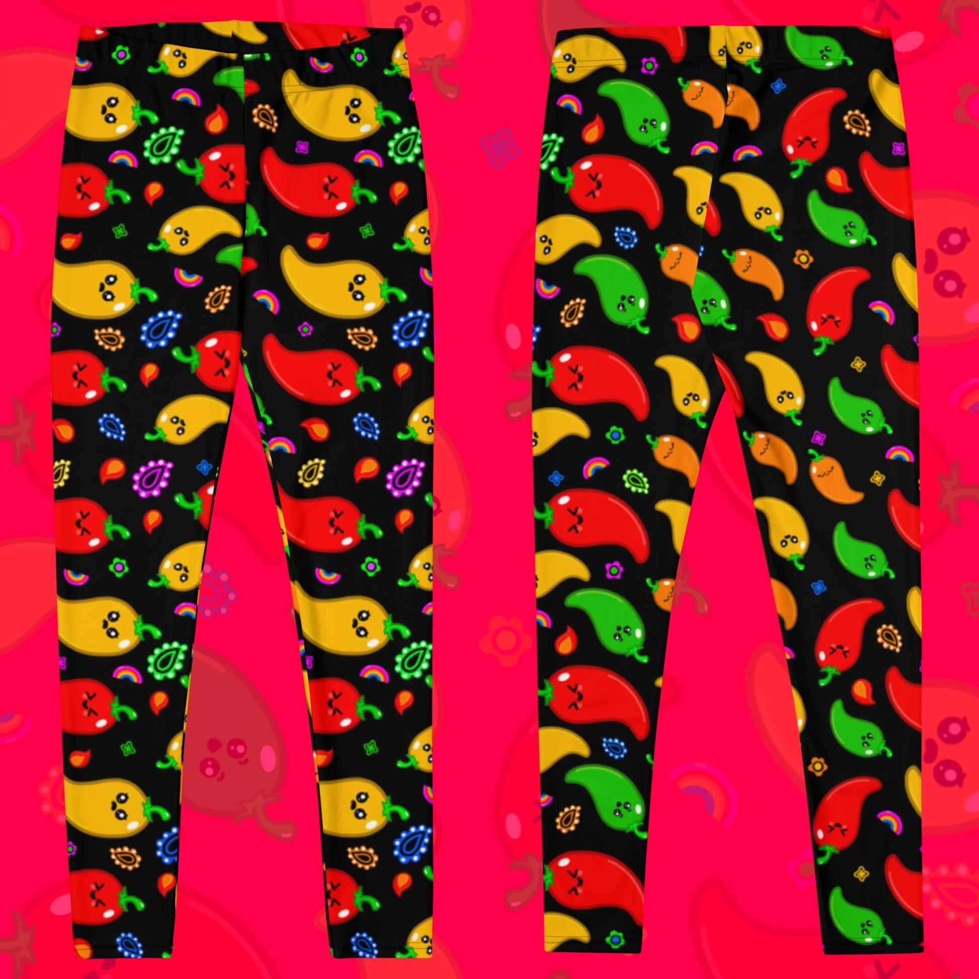 Black leggings with red, green, orange and yellow chilli peppers with cute faces on and various cute doodles around them. The background of the photo is a faded close up of the print. The hand drawn design is raising awareness for neurodiversity.