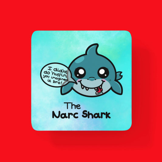 The Narc Shark Coaster - Narcissism on a red background. The blue wooden coaster features a blushing smiling blue shark chewing a red shoe and a speech bubble reading 'I didn't do 'nuffin, you imagined it bro!'. Underneath the great white shark is black text that reads 'the narc shark'. Design is raising awareness for narcissistic abuse.