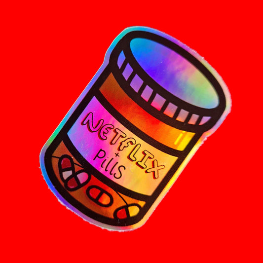 The Netflix & Pills Holographic Sticker on a red background. The holographic shiny rainbow pill bottle sticker filled with red and white tablets with a label that reads 'netflix + pills'. A cheeky hand drawn design to raise awareness for hidden disability prescriptions.