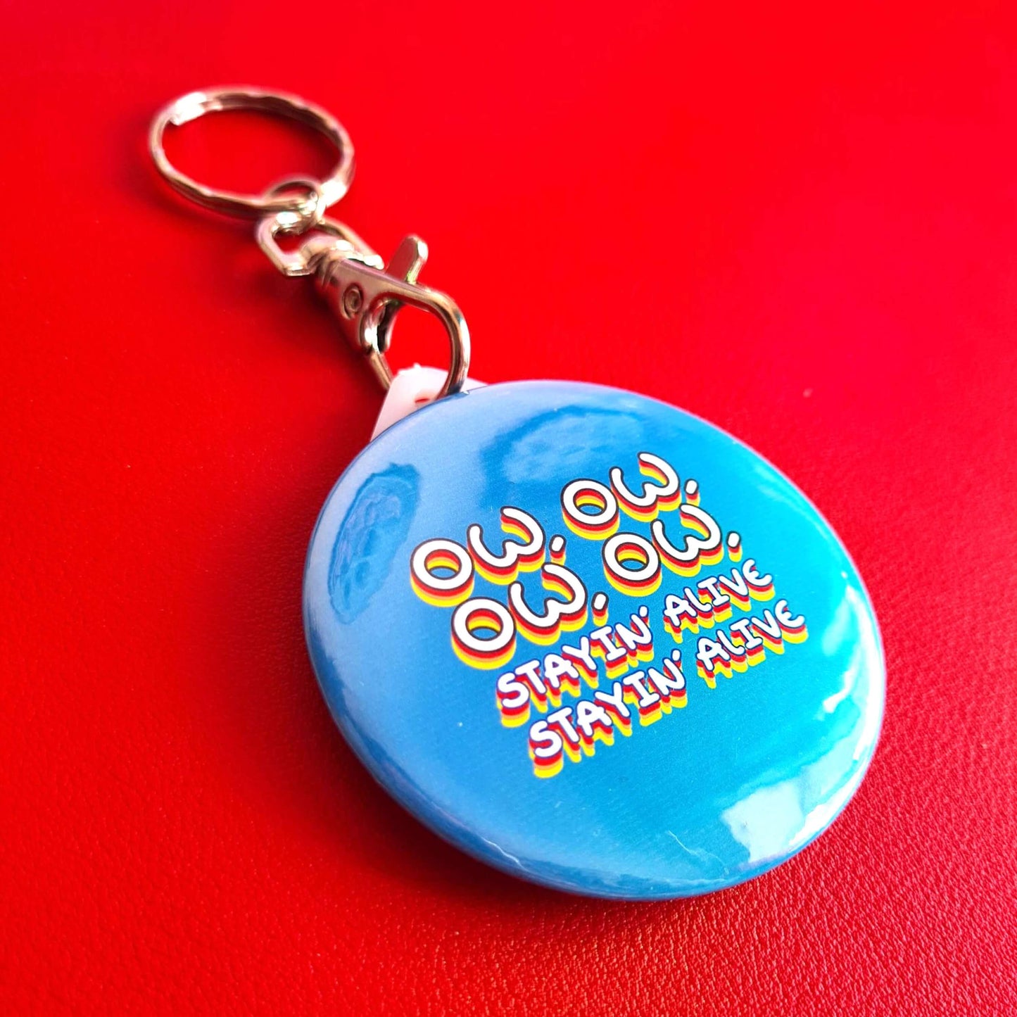Ow, Ow, Ow, Ow, Staying Alive Keyring