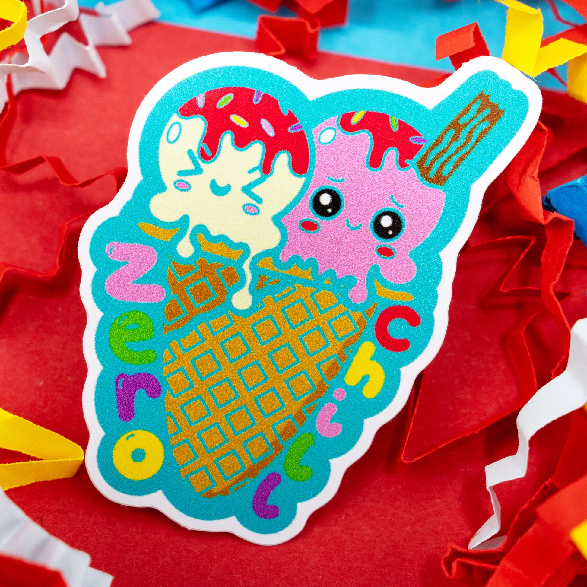 Adorable Zero Chill ice cream vinyl sticker by Innabox featuring two melting scoops with cute smiling faces in a waffle cone and colourful rainbow text. A playful mental health and neurodivergent themed design perfect for adding positivity to your laptop, notebook or water bottle. Gloss vinyl, waterproof, custom cut and around 5 cm tall.