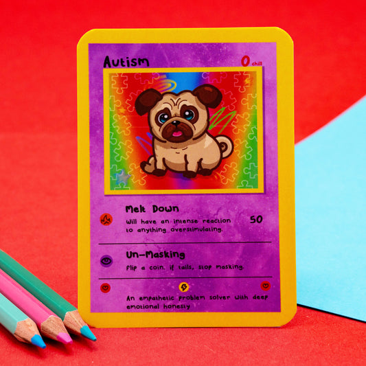 Autism collectable trading card by Innabox featuring a cute cartoon pug with big eyes on a rainbow puzzle background. The purple card includes traits like “Meltdown” and “Unmasking” with playful text to raise awareness. Designed to support and uplift neurodivergent and autistic people.