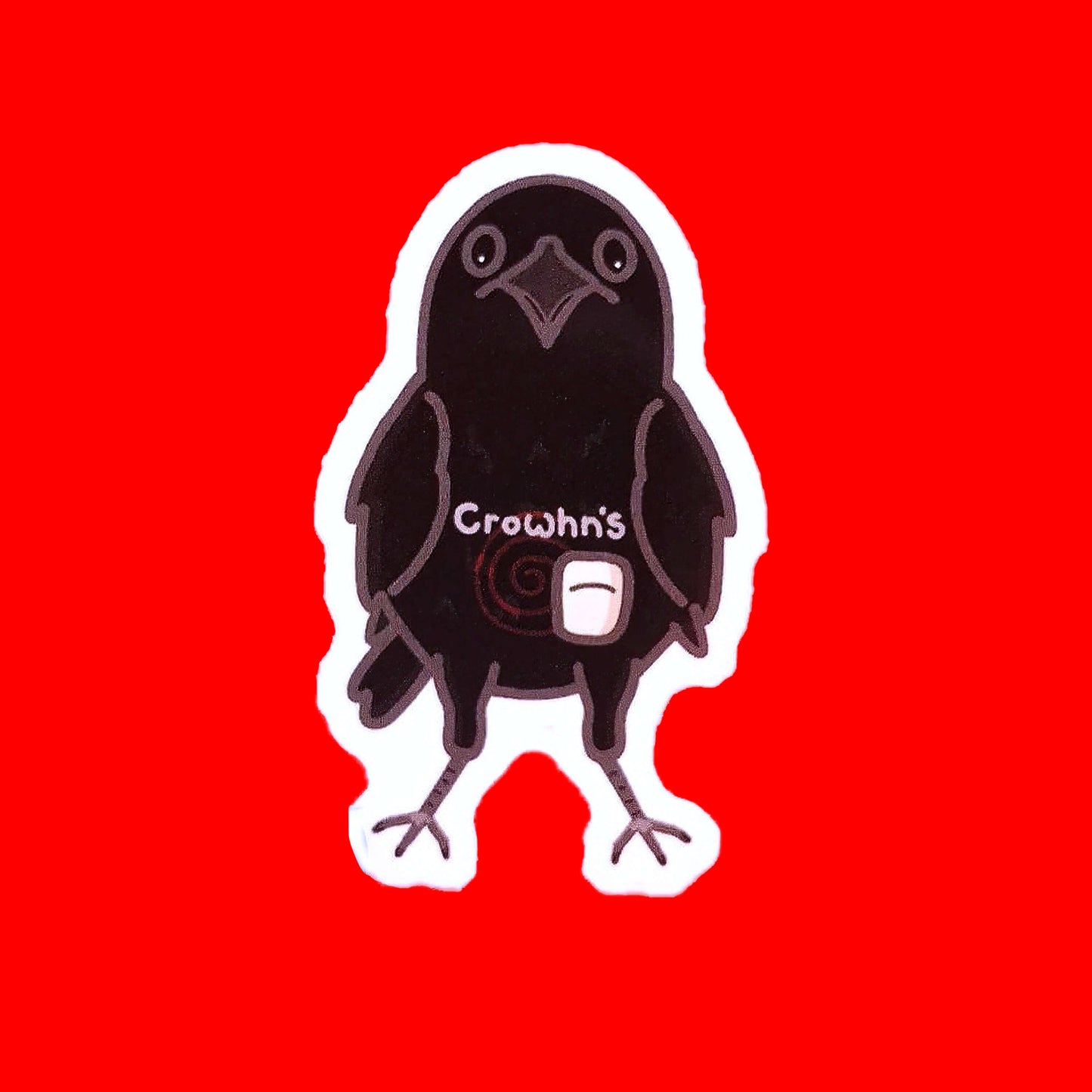 The Crowhn's Sticker - Crohn's Disease on a red background. The black crow shaped sticker has a stoma bag fitted with a red swirl and white text reading 'crowhn's' across its belly. The design is raising awareness for crohn's disease.
