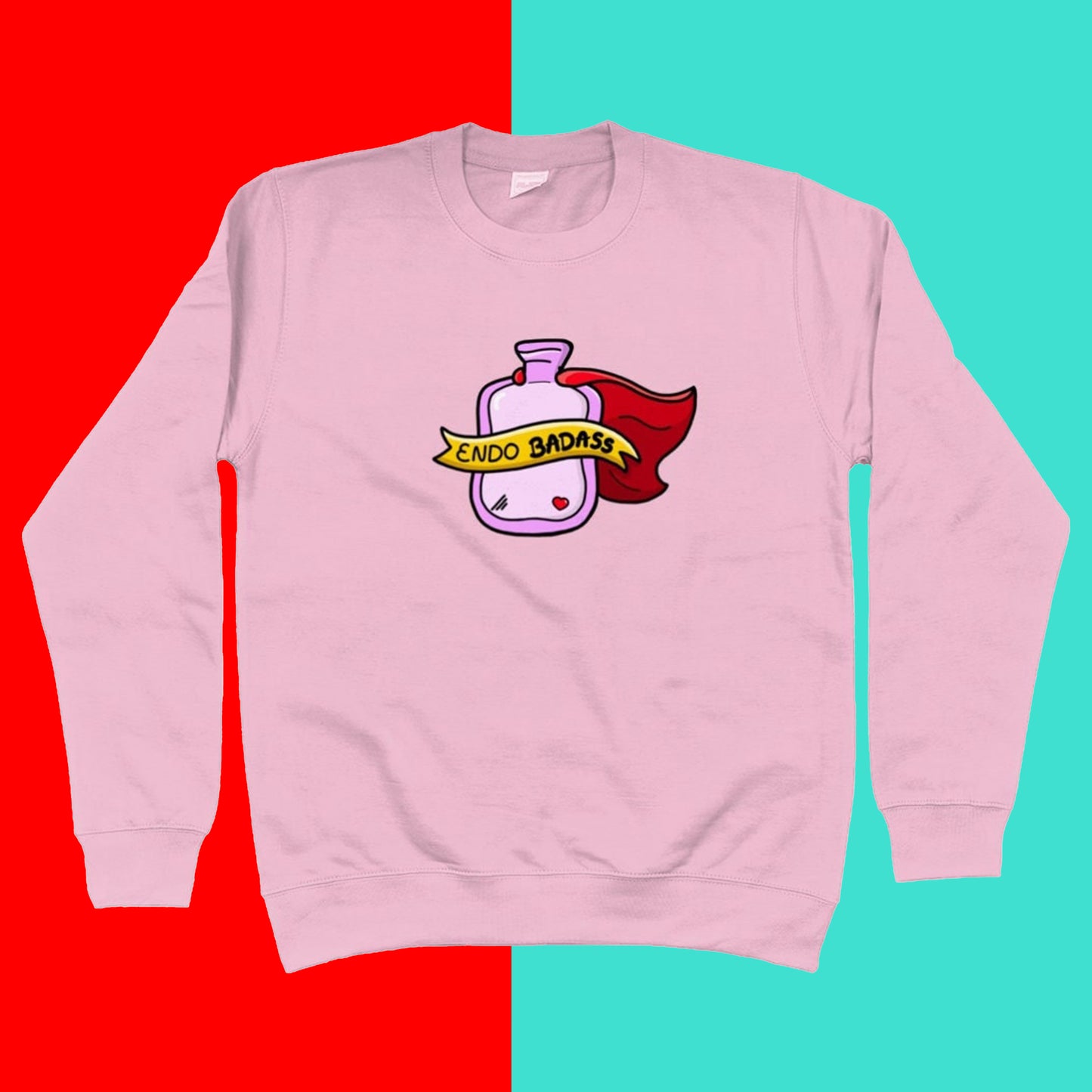 The Endo Badass Sweater - Endometriosis on a red and blue background. A pastel bubblegum baby pink sweatshirt jumper with a pink hot waterbottle with a small red heart, red cape and yellow banner reading 'endo badass' in black text. The hand drawn design is raising awareness for endometriosis and pelvic pain.