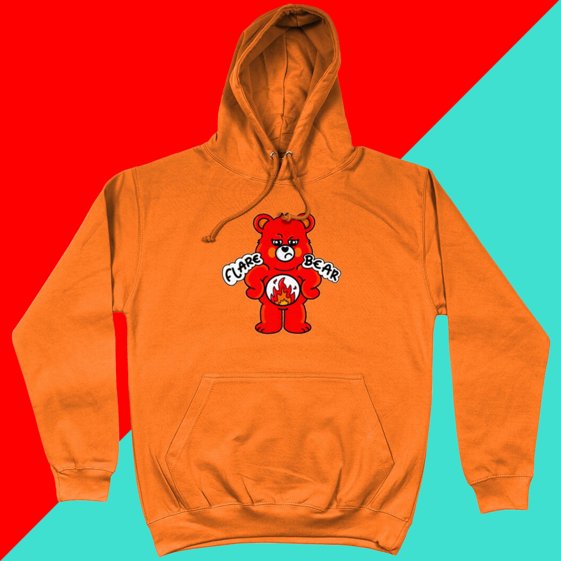 Flare Bear hoodie jumper in orange crush shown on a red and blue background. The hoodie is of a red bear with a fed up expression and hands on its hips. There is a white circle on its belly with flames inside. Flare Bear is written on the hoodie. The hoodie is designed to raise awareness for chronic illness flare ups.