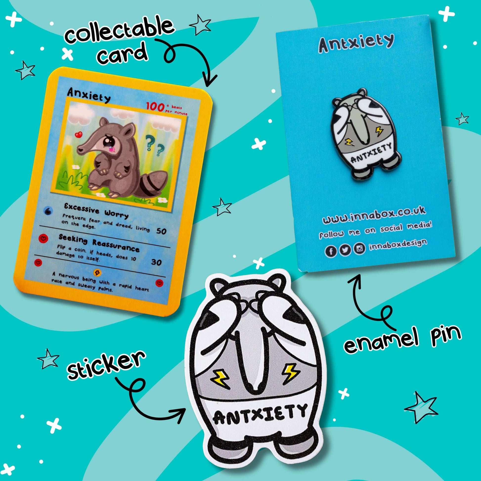 Flat lay of the Antxiety bundle by Innabox on a teal starry background, showing three items: a collectable trading card featuring a cute anxious anteater character with worry-related stats, a hard enamel pin on a branded backing card, and a vinyl sticker of the same character. The items are labelled with playful handwritten text and black arrows pointing to each product.