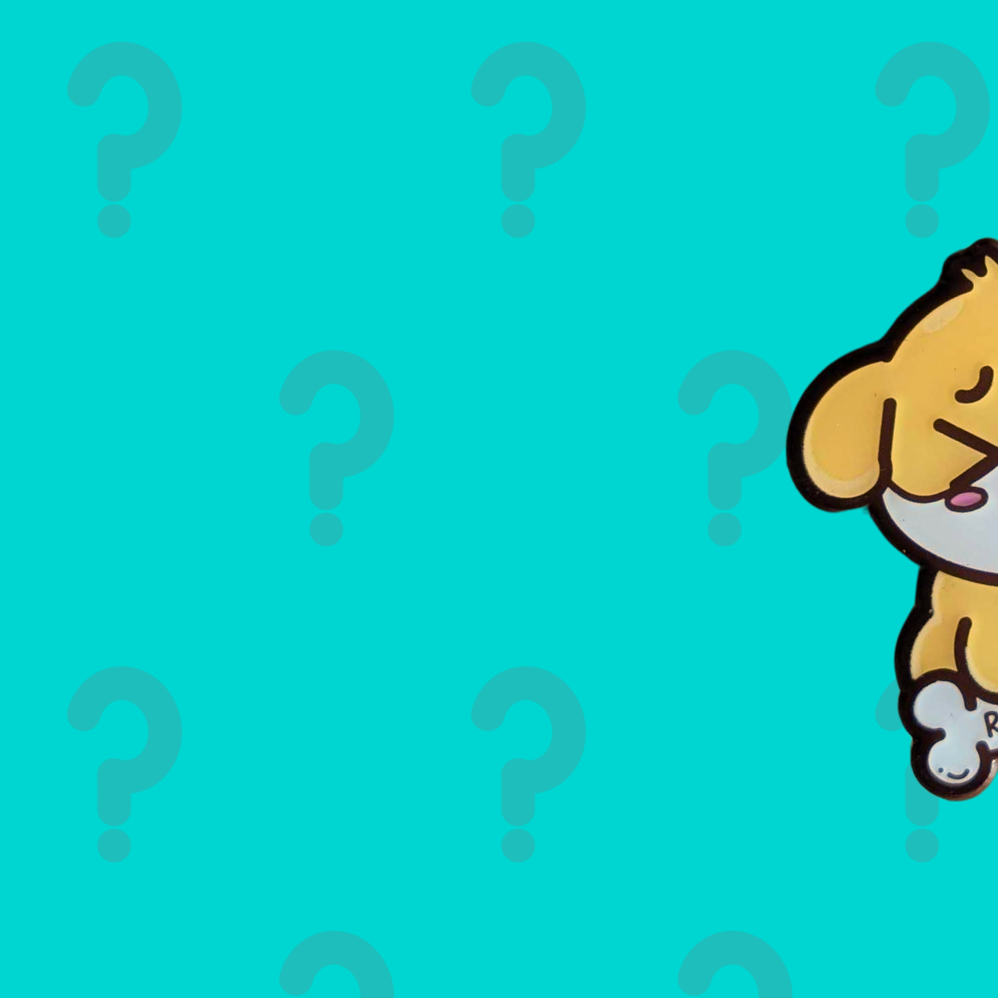 Close up teaser of the Innabox January mystery enamel pin, with parts of the character obscured to keep the design a surprise.