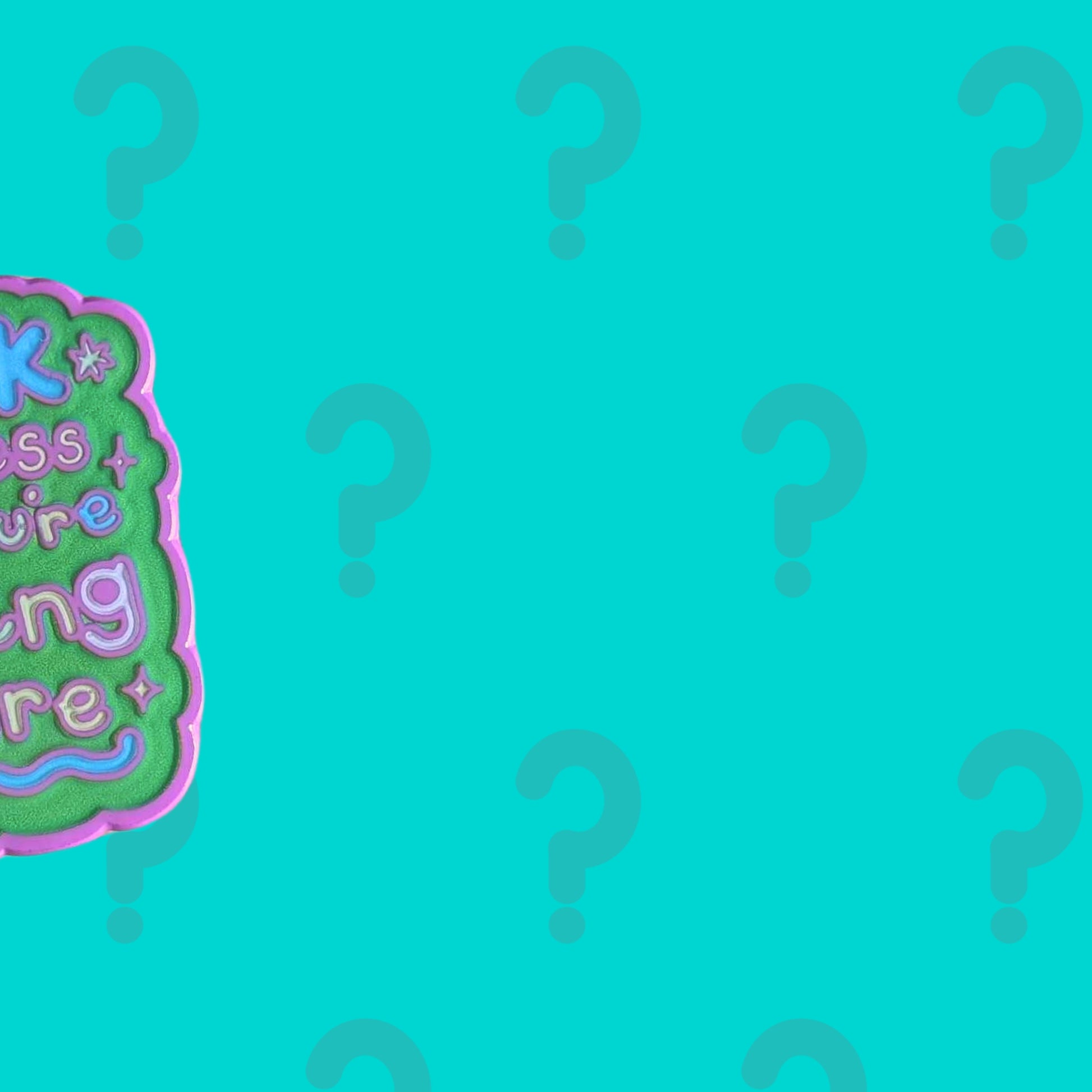 Close up teaser of Innabox March Mystery Enamel Pin showing part of a bright green and purple enamel design cropped at the edge on a teal background with question marks. Exclusive disability positive enamel pin subscription supporting those with chronic illnesses and hidden disabilities.
