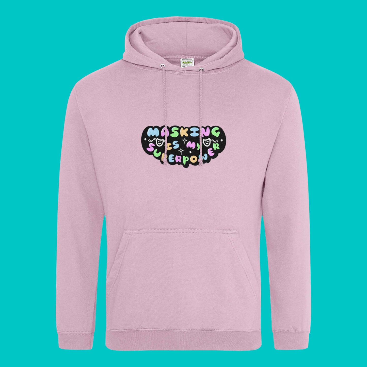 The baby pink Masking Is My Super Power Hoodie on a blue background. The pastel pink hoodie features pastel rainbow bubble writing that reads 'masking is my superpower' with white sparkles, a happy and sad drama masks all on a black oval. Raising awareness for neurodivergent people with ADHD or Autism.