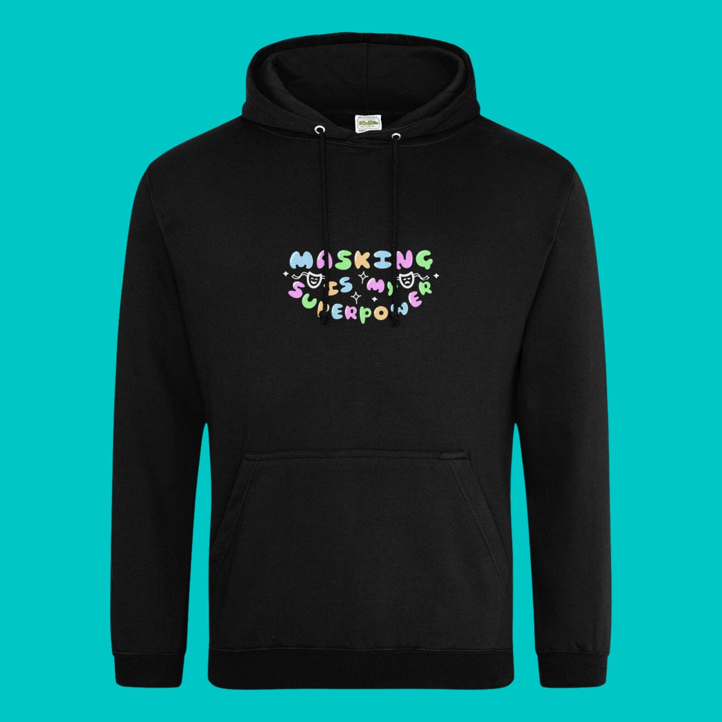 The deep black Masking Is My Super Power Hoodie on a blue background. The black hoodie features pastel rainbow bubble writing that reads 'masking is my superpower' with white sparkles, a happy and sad drama masks all on a black oval. Raising awareness for neurodivergent people with ADHD or Autism.