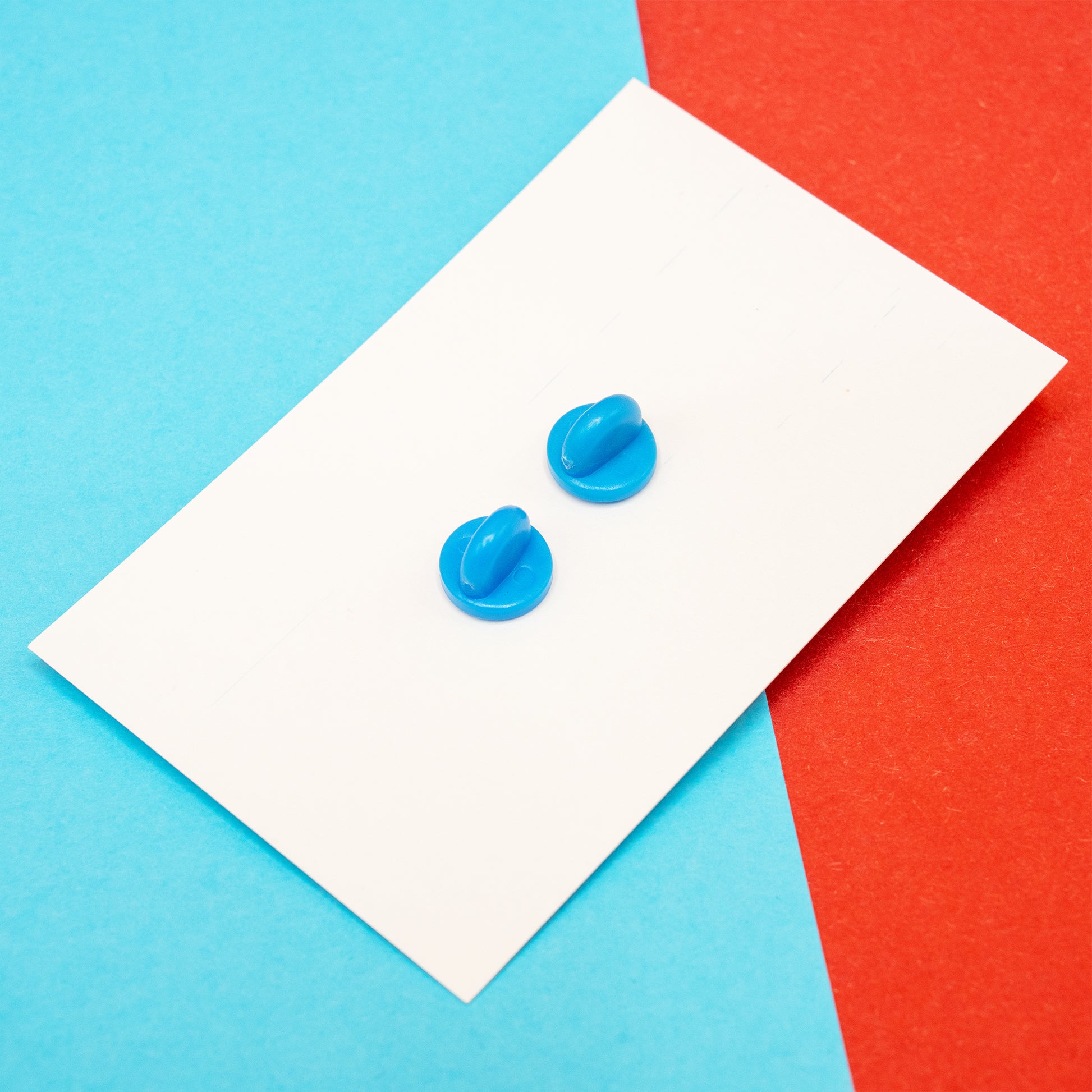 The Innabox ‘It’s Time For A Meltdown’ Snowman Enamel Pin displayed on its backing card, photographed on a bold blue and red background. The pin features an adorable snowman with a cosy hat and scarf and the phrase “It’s time for a meltdown”. A disability inspired enamel pin designed to support and uplift anyone with chronic illness or hidden disabilities.