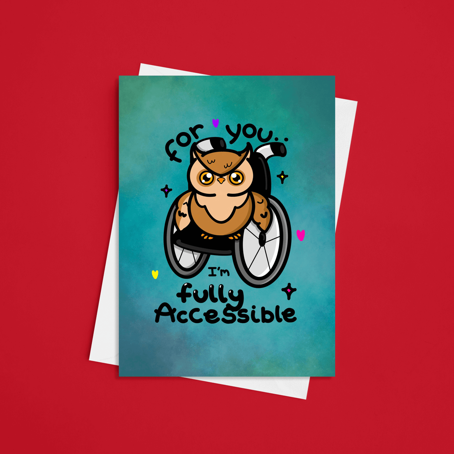 A blue greeting card with an illustration of a brown owl in a wheelchair with pink, purple and yellow love hearts and sparkles dotted around it. 'For you I'm fully accessible' is written on the card in black. The valentines day themed card is on a red background with a white envelope. Design inspired by disabilities.