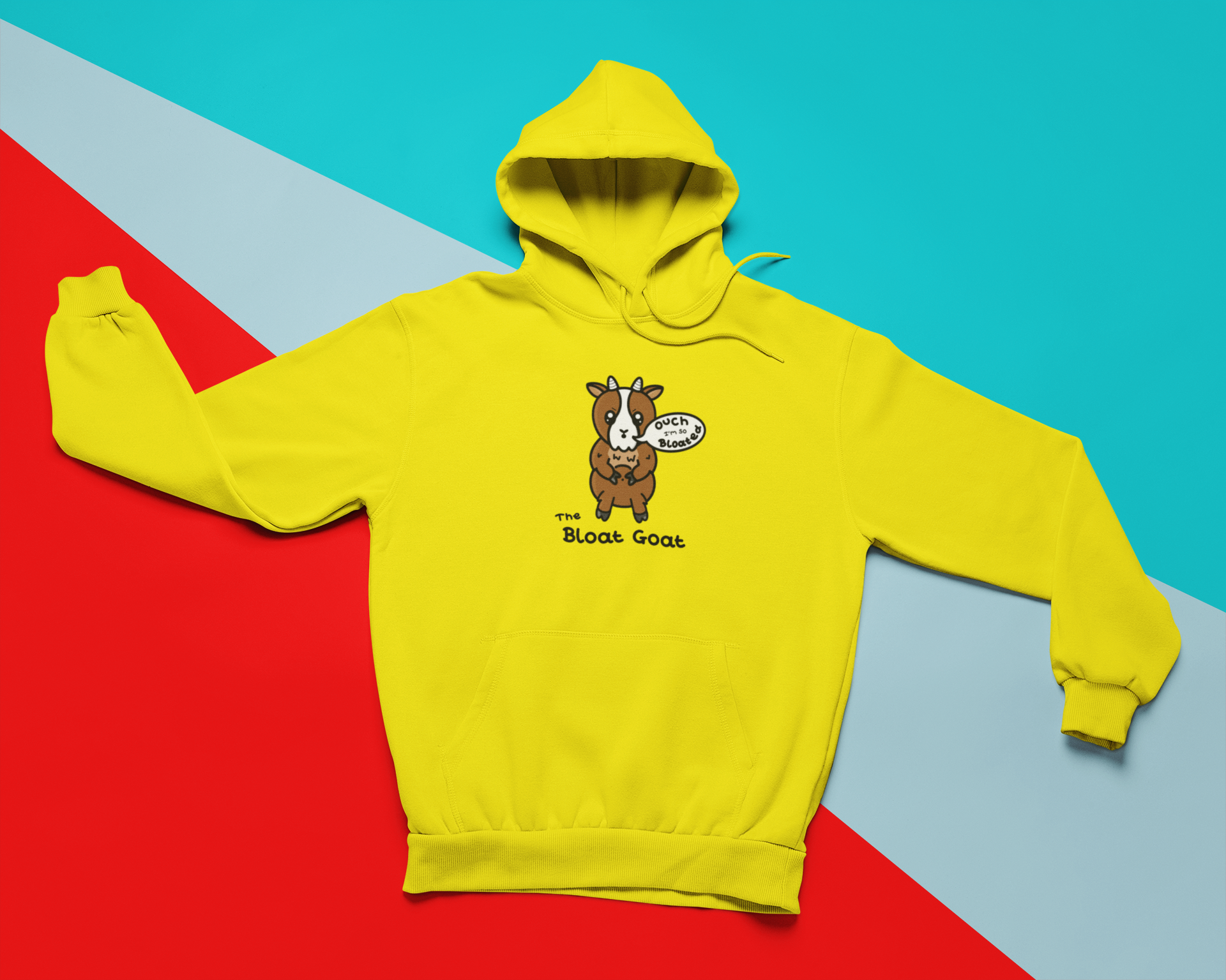 A yellow hoodie with a little brown goat with little white horns and a white centre of it's face. The goat has big sparkly eyes with angular eyebrows and moth in an 'o' shape with a white speech bubble coming out of it with 'ouch I'm so Bloated" written inside it. The goat is holding onto it's light brown fluffy tummy with it's upper legs. 'The Bloat Goat' is written in black under the goat.
