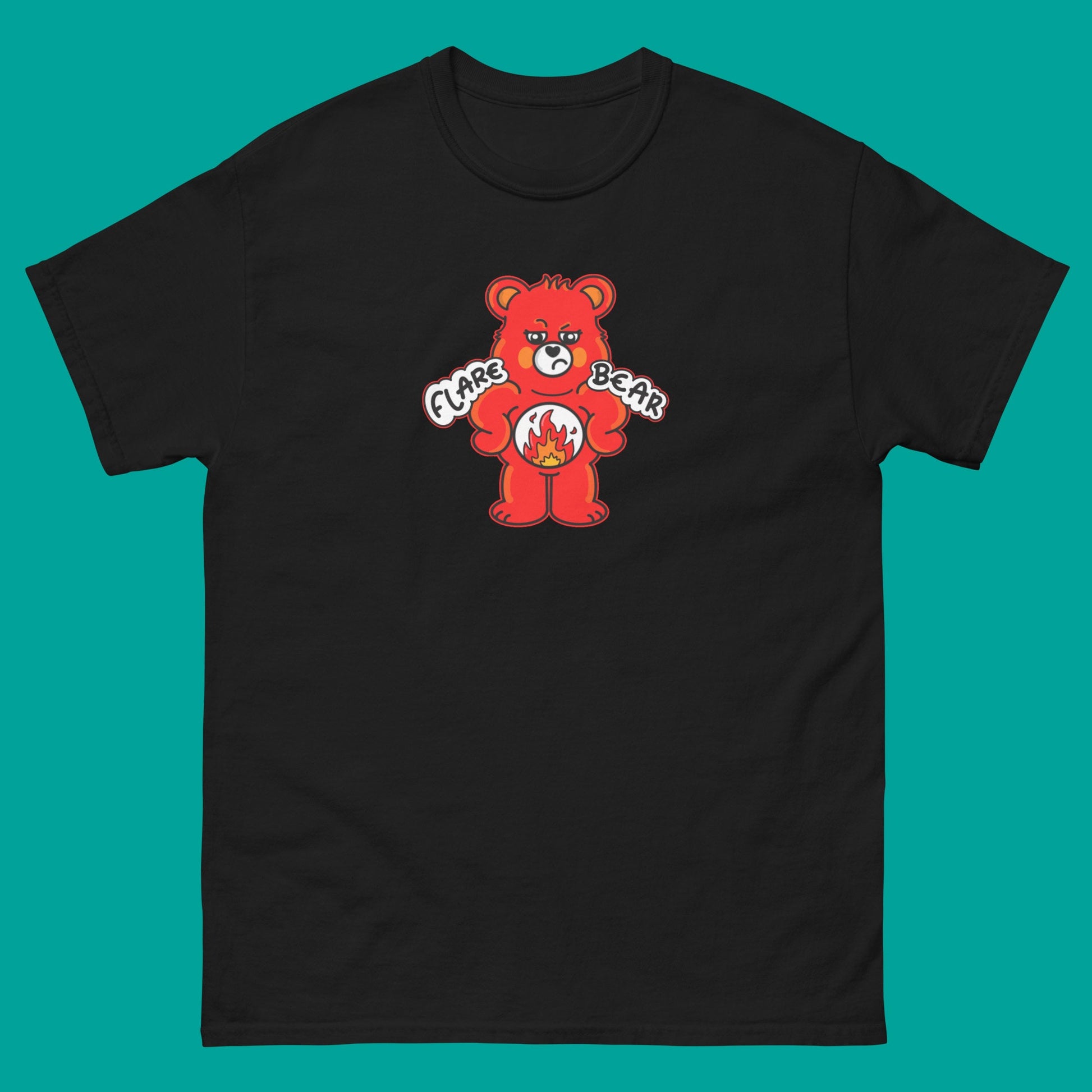 Flare Bear T-shirt on a blue background. The black short sleeve tshirt is of a red bear with a fed up expression and hands on its hips. There is a white circle on its belly with flames inside. Flare Bear is written on the middle. The tshirt is designed to raise awareness for chronic illness flare ups.